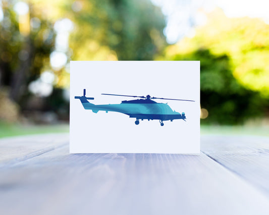 A greeting card in which there is a wildcat helicopter filled with the light and dark blue colours of the Army Air Corps.