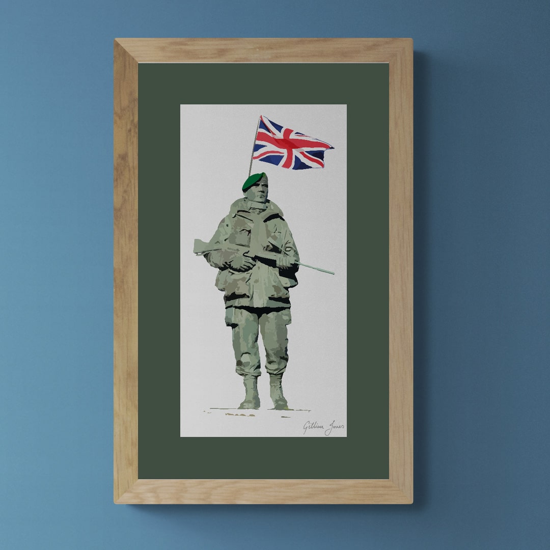 An art print of a Royal Marine Yomper holding a rifle on a white background with a union jack flag behind him.